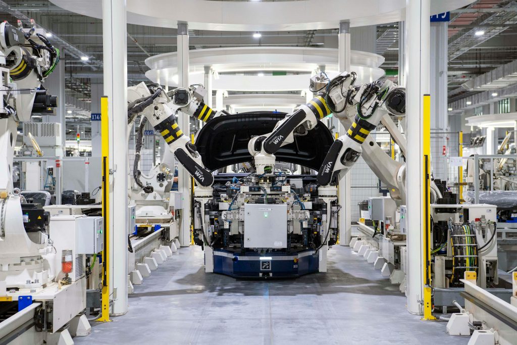 Photo by Hyundai Motor Group on Pexels. Shows many robotic arms assembling a (presumably) car on a manufacturing line. Likely one of many robots in that factory.