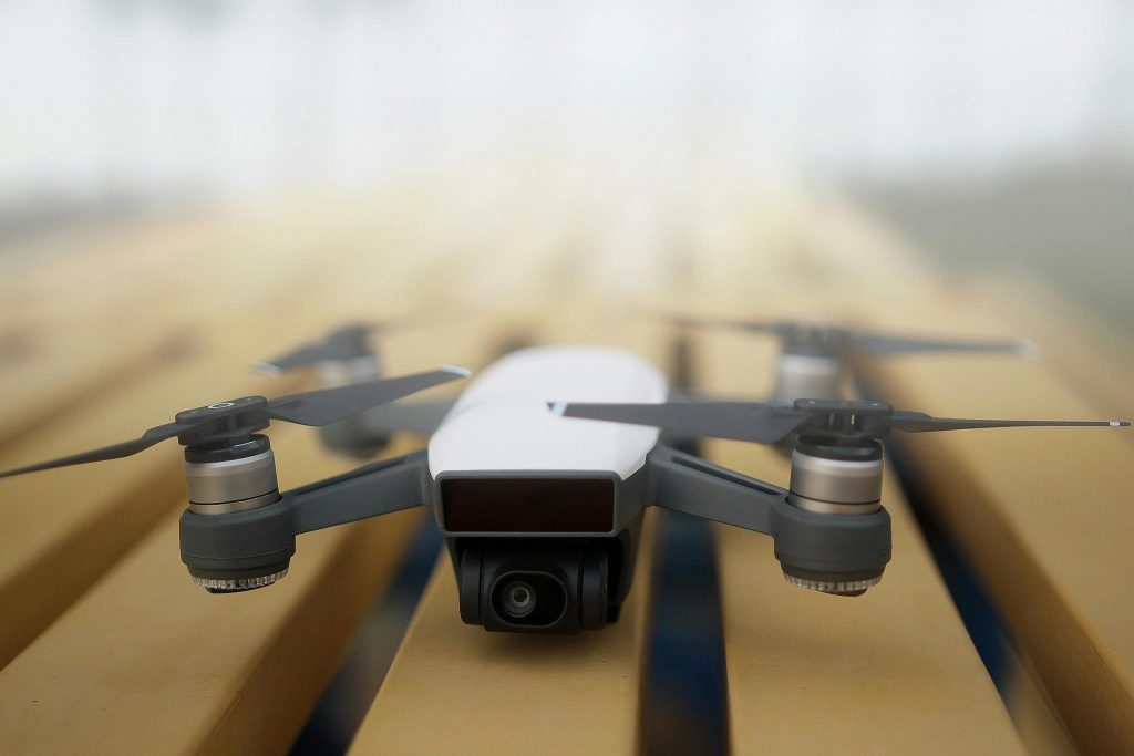 Photo by Pok Rie on Pexels. Shows a drone sitting on narrow boxes.